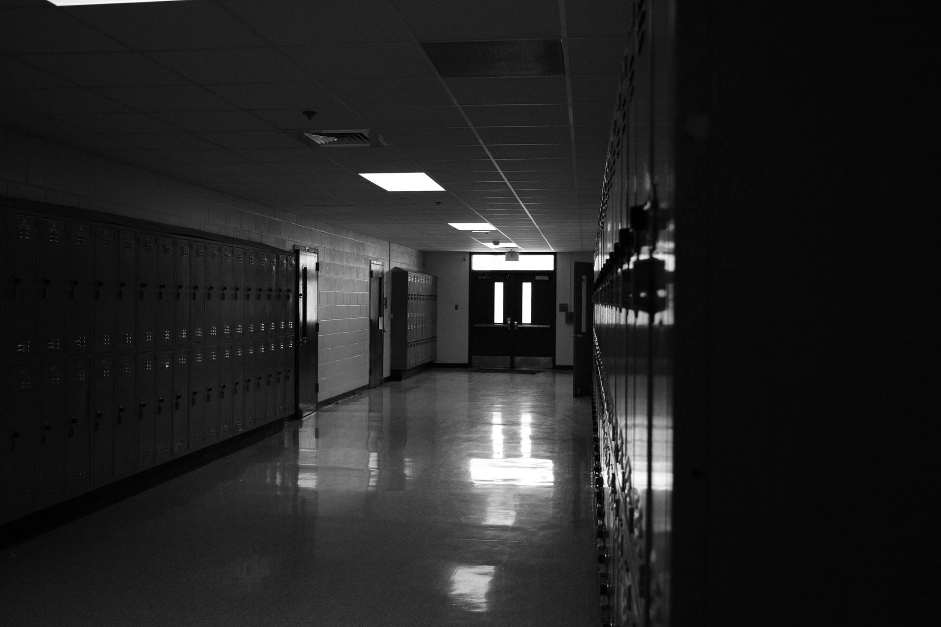 Empty school hallway in grayscale