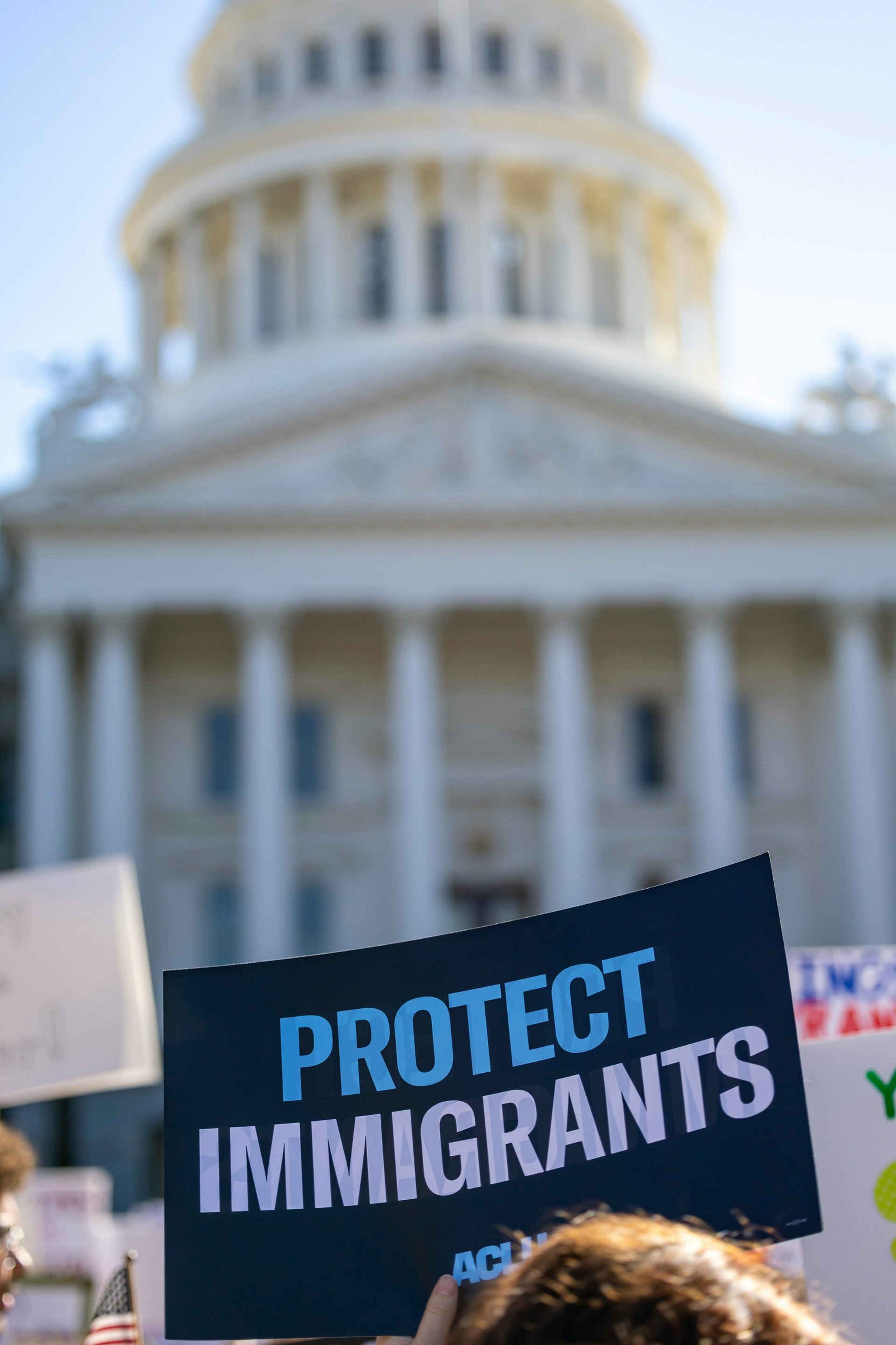 Protesters at the capitol advocating for immigrant rights