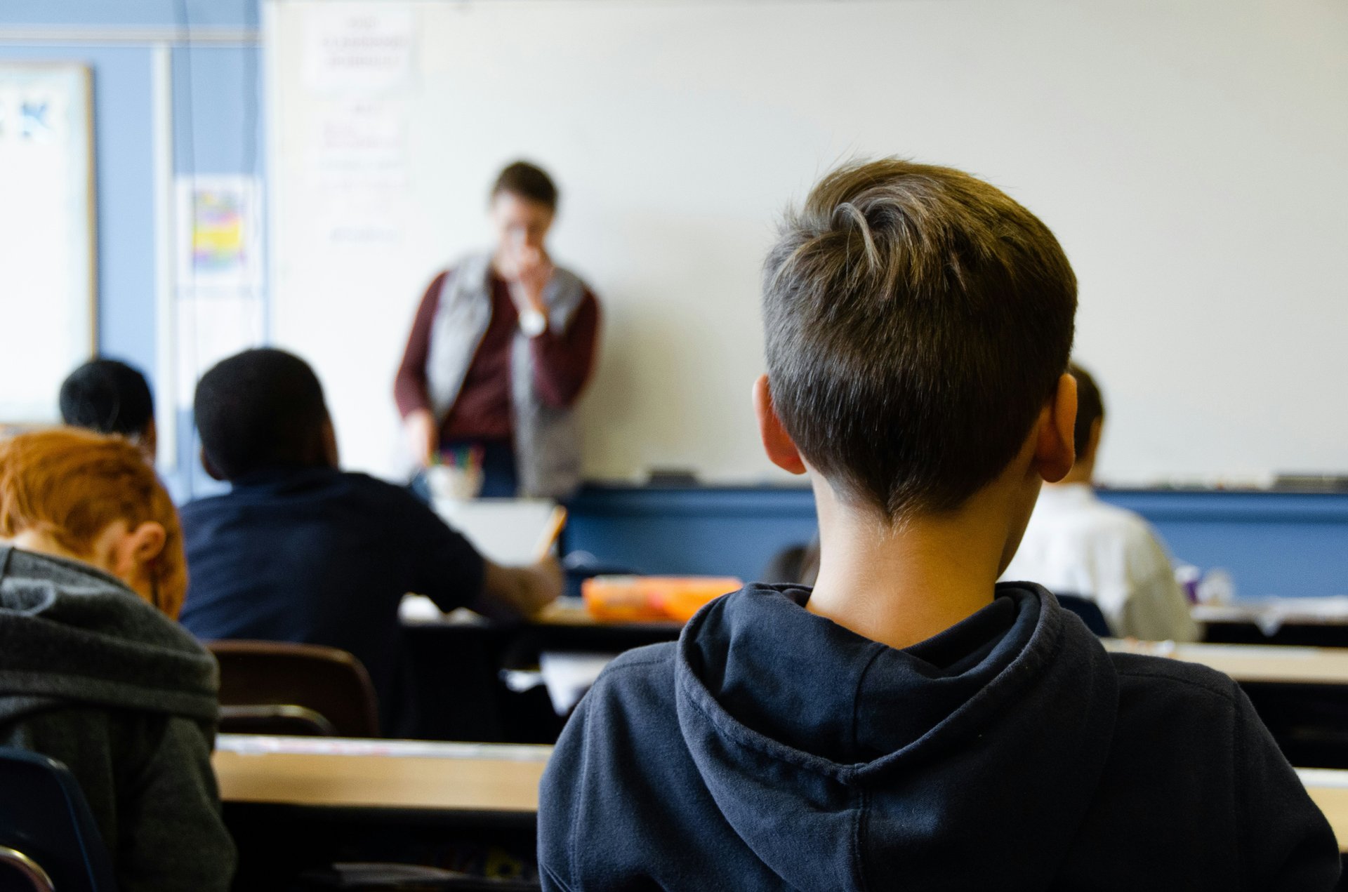 Students listening to a teacher in class